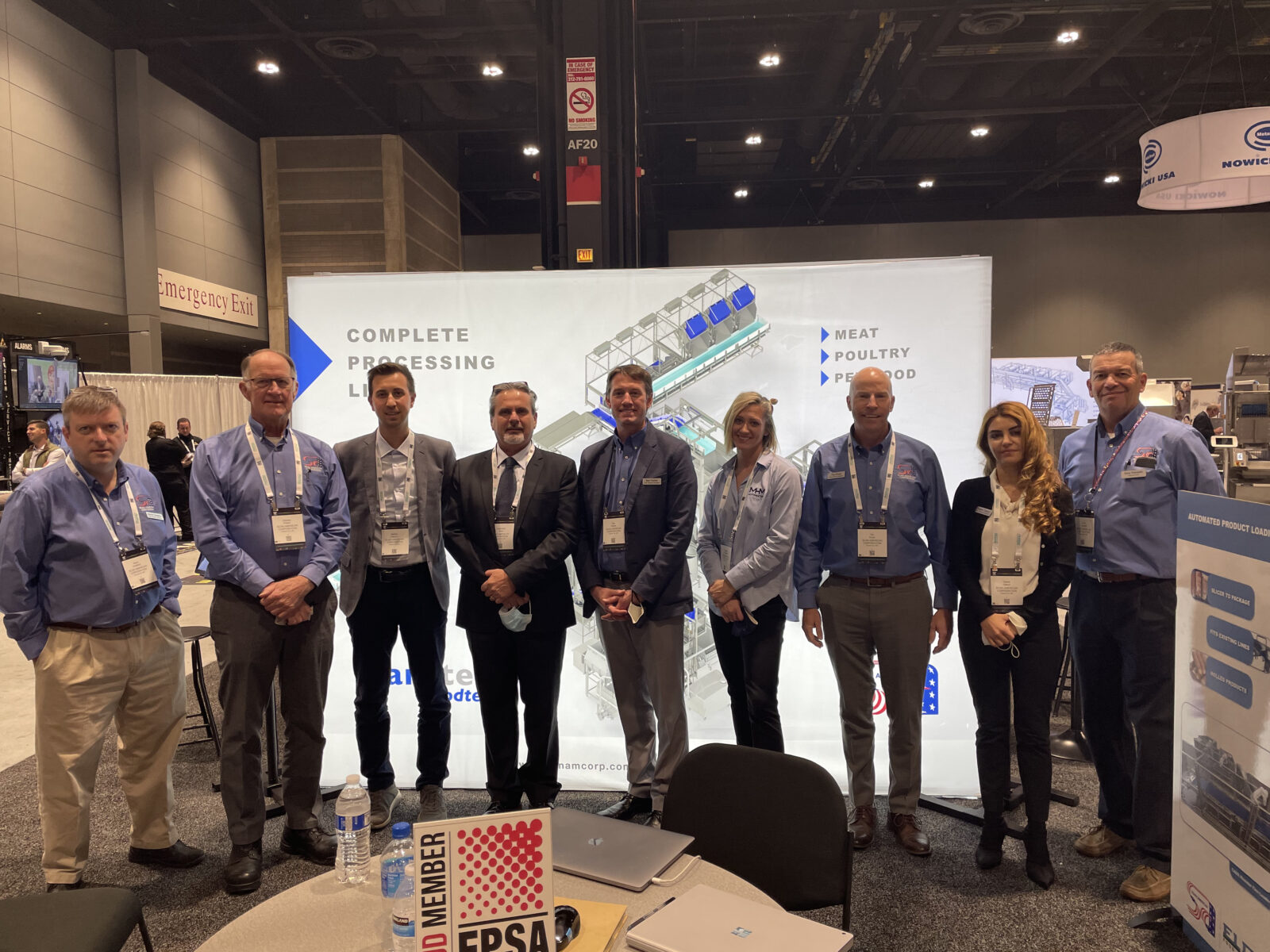Group photo of the Scan American team and partners inside the booth at Process Expo 2021.